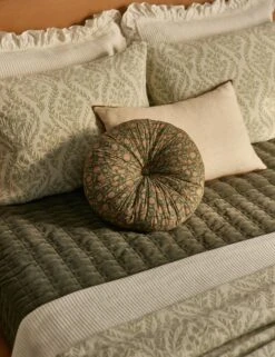 Fransen Linen Cotton Tufted Round Pillow 13 Fransen Linen Cotton Tufted Round Pillow -Home Decor Sale Lulu and Georgia 23b BedroomIAngleII 7112 LIFESTYLE Site Crop LIFESTYLE